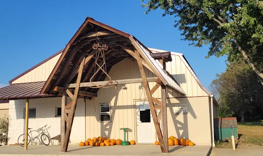 The Red Wing Orchards farm sales room with pumpkins out front